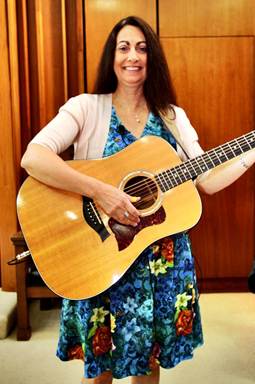 A person holding a guitar